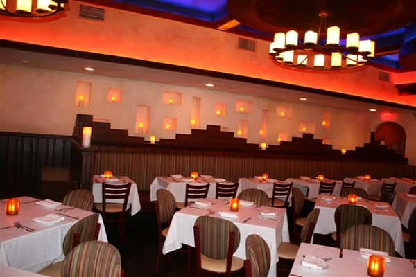 multiple tablecloth tables in Caracara Mexican Grill with candles as centerpieces