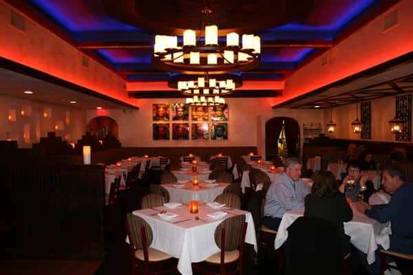 inside view of caracara mexican grill, with multiple tablecloth tables