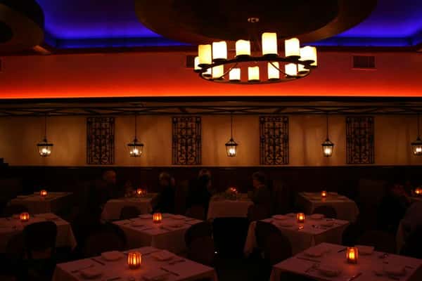 inside view of caracara mexican grill, with multiple tablecloth tables