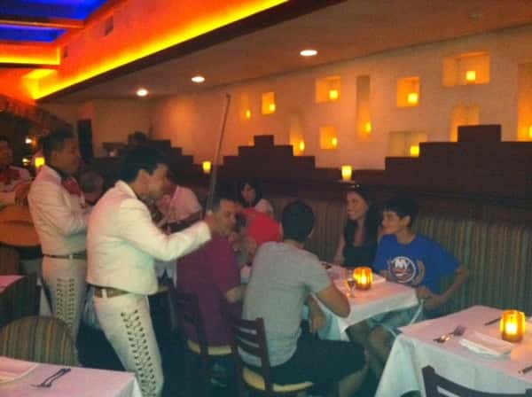 live band playing around a table of customers