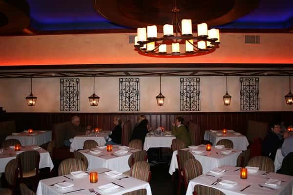 inside view of caracara mexican grill, with multiple tablecloth tables