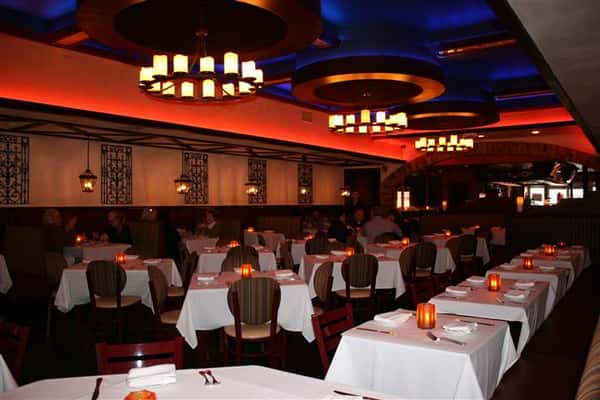 inside view of caracara mexican grill, with multiple tablecloth tables