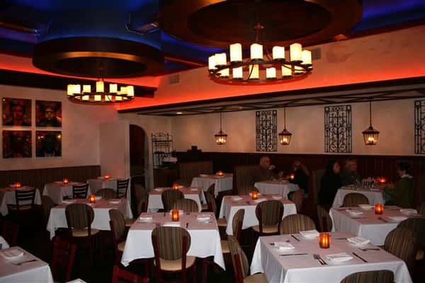 inside view of caracara mexican grill, with multiple tablecloth tables