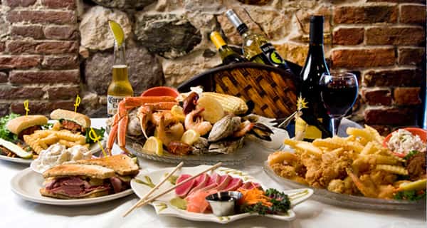 Several dishes on a table full of food