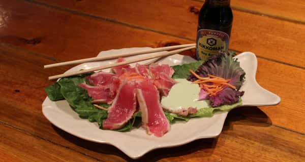 slice-cutted seafood dish on a white plate