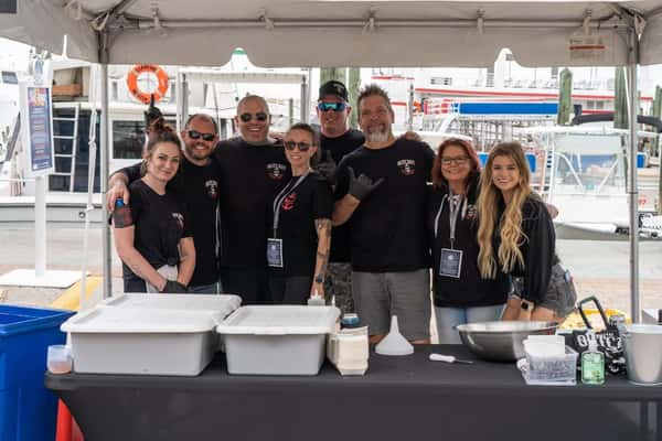 staff members behind table at an event