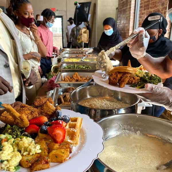 Banquet table surrounded by happy customers