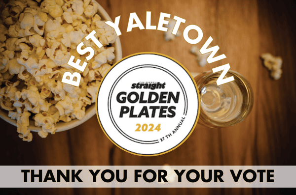 a photo of popcorn and sparkling wine with a thank you message to those who voted for us in the golden plate awards.