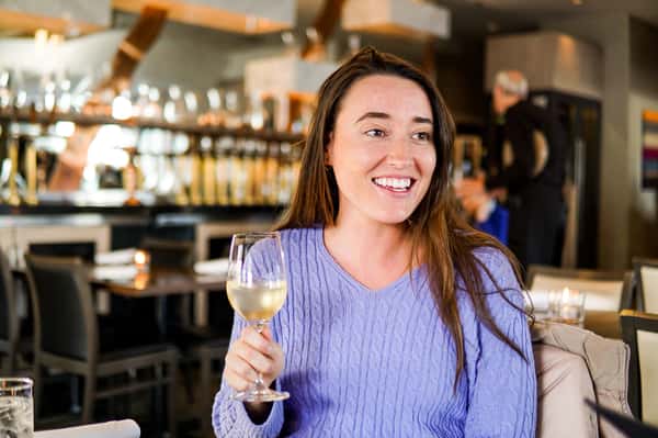 happy girl with wine at provence marinaside