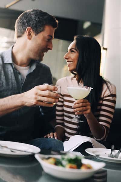 happy couple toasting at provence marinaside