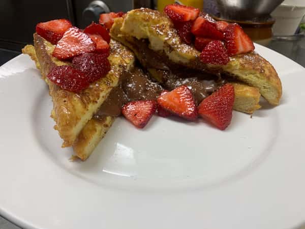 Nutella French Toast topped with powdered sugar & fresh strawberries