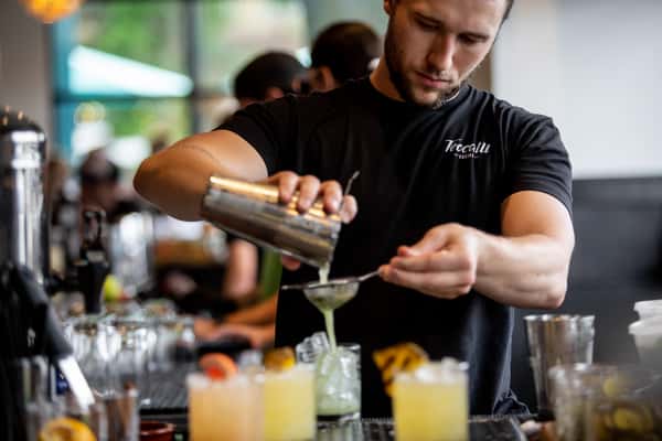 Bartender making an amazing cocktail