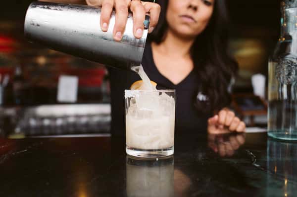 Bartender making an amazing cocktail