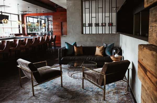 Cocktail lounge area with comfortable seating close to the bar