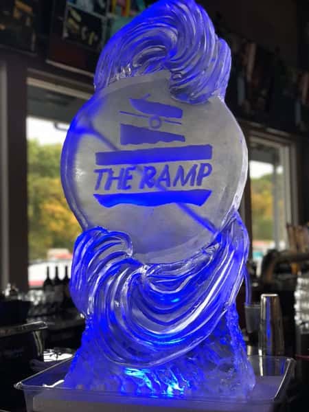 An ice sculpture that has "The Ramp" engraved into it