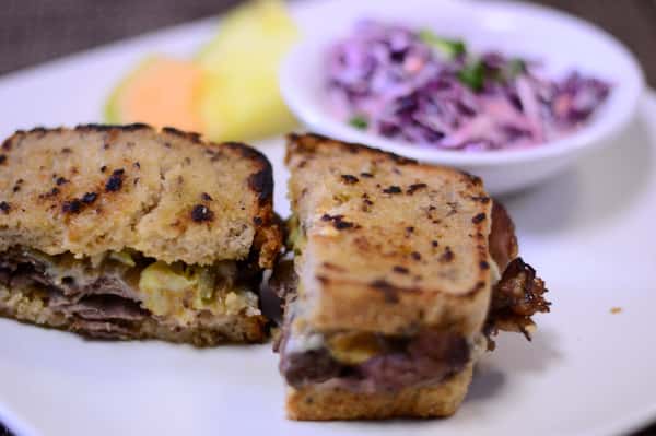 Roast beef sandwich with cheddar cheese.