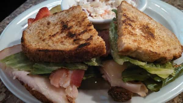 Heirloom turkey sandwich. Heirloom tomatoes, turkey, mayonnaise, Havarti, romaine & onions.