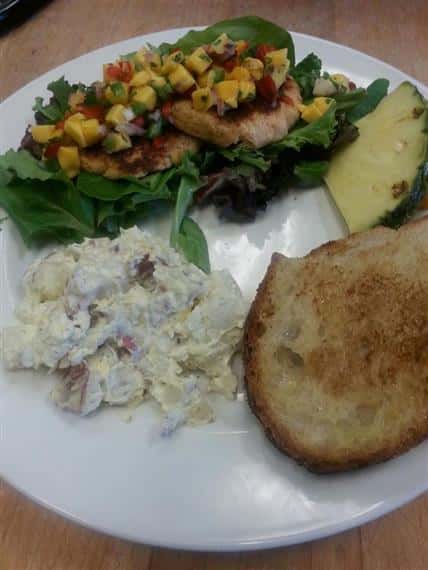 Jerk pork loin with mango salsa, bread, smashed redskin potatoes