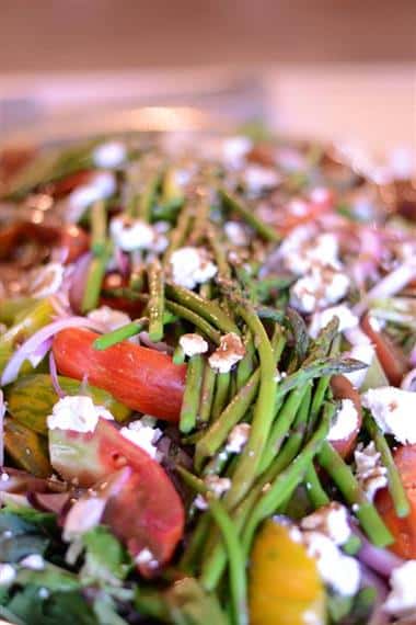 Asparagus, tomatoes, red onions and crumbled cheese