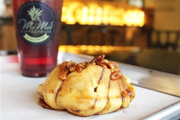 a pastry with an iced tea in the background
