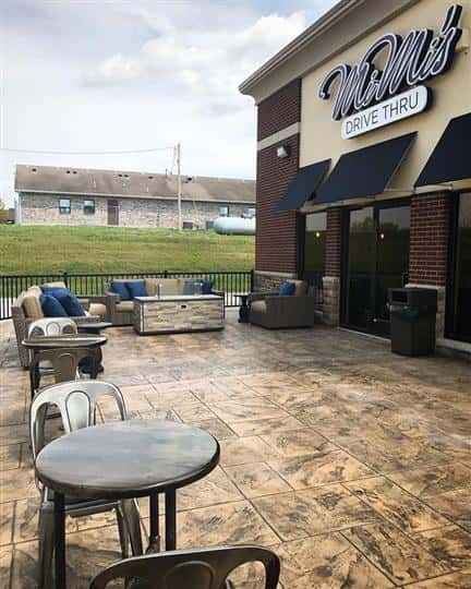 outdoor seating area of two seats per table with three couches