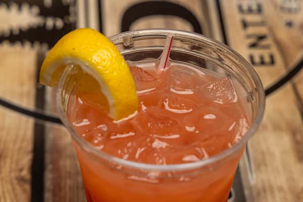 Orange cocktail with a lemon