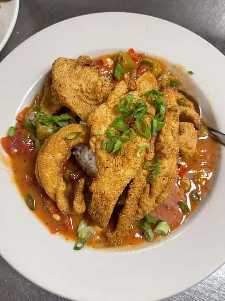 fried fish dish on a white plate