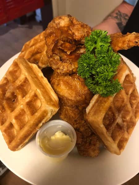 Honey Fried Chicken & Blueberry Waffles: Honey battered chicken tenderloins & a delicious blueberry Belgium waffle with huckleberry syrup, butter & fresh berries