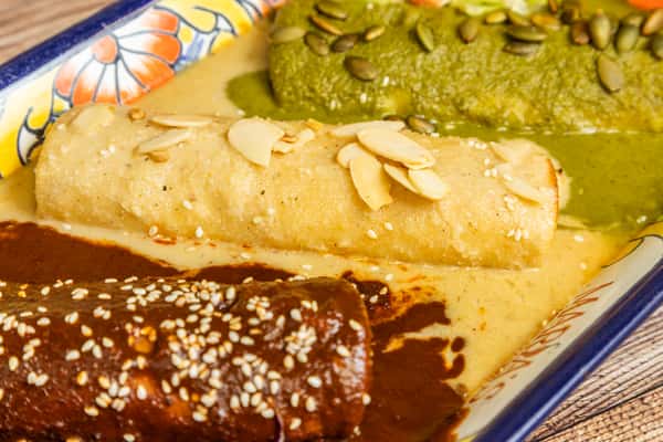 Mexican mole entrée served with rice, beans, guacamole, and traditional sides