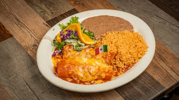 Enchiladas topped with fresh salad, served with Mexican rice and refried beans