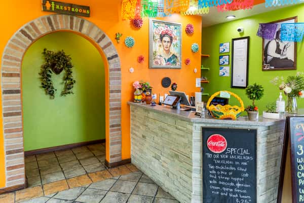Front counter and entrance area decorated with colorful Mexican artwork