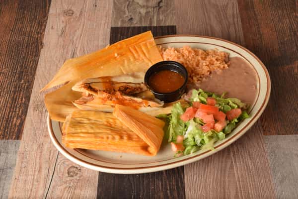 Tamales with salsa, Mexican rice and fresh salad