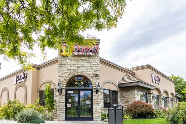 Street-level exterior view of Maria's Mexican Grill with landscaped entrance