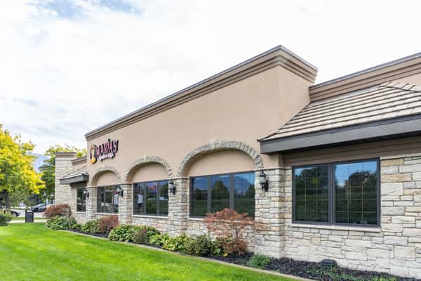 Exterior side view of Maria's Mexican Grill building and landscaped grounds
