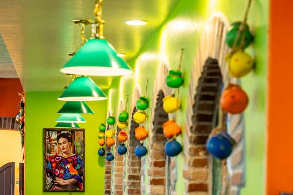 Colorful hanging decorations and pendant lights inside Maria's Mexican Grill