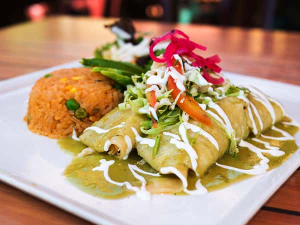 Enchiladas Sirenitas is our third special for this week! 🍽

Two enchiladas filled with shrimp, crabmeat, and spinach, covered with tomatillo sauce, topped with avocado and sour cream, and served with Mexican rice and a side salad.
