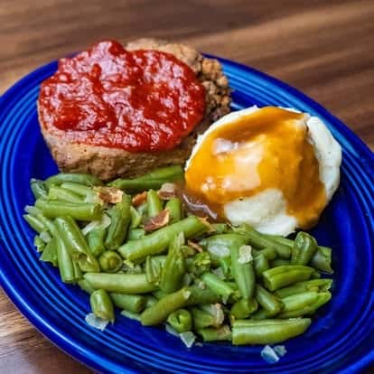 mashed potatoes, green beans and meat