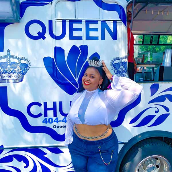 queen in front of truck