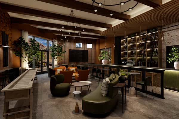 Chic bar with warm wood finishes, inviting seating, and ambient lighting near Zion National Park, providing a cozy space to enjoy global comfort food and local beverages.