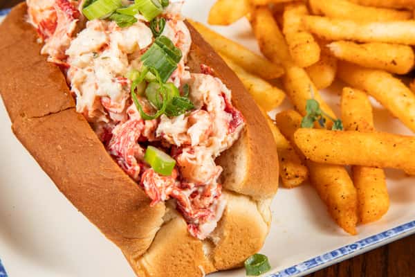 buttery lobster roll filled with fresh lobster meat served with golden french fries
