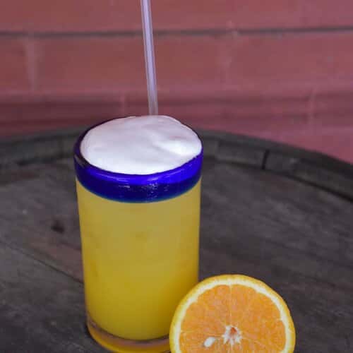 Orange alcoholic drink.