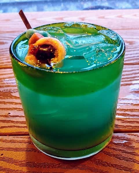 Green alcoholic drink.
