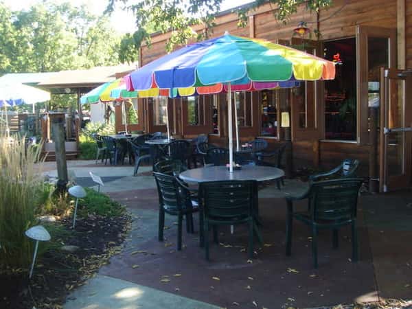 Outdoor patio with dining tables with umbrellas
