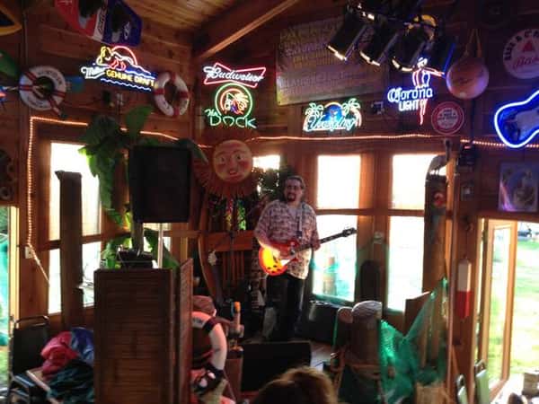 Stage with a performer playing the guitar