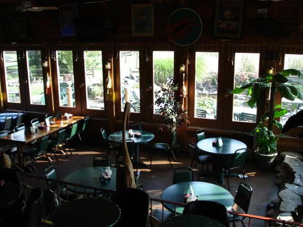 Photo of dining area with windows in the background