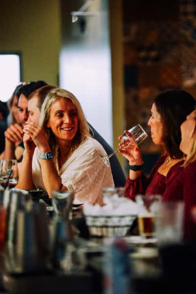 people eating and drinking together