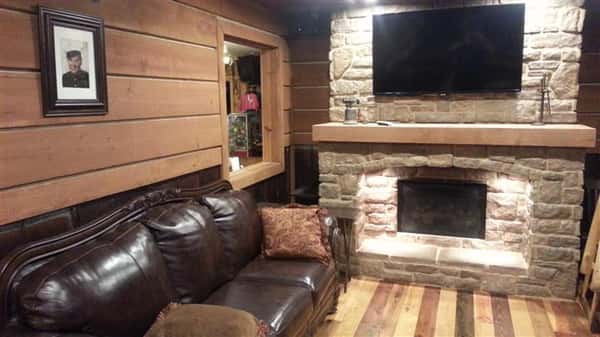 a couch by a fireplace