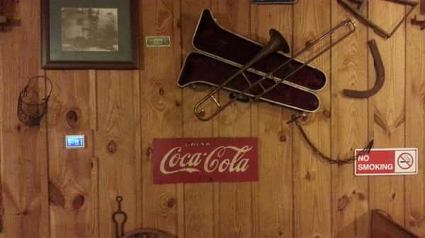 coca cola sign and an instrument on the wall
