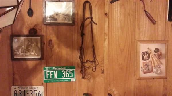 pictures and a license plate on the wall