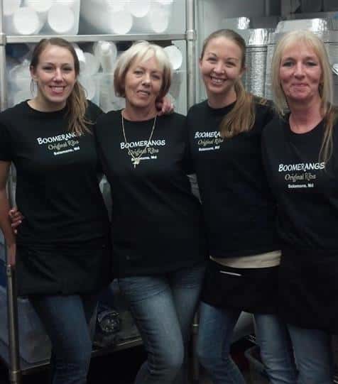 employees together smiling for a photo